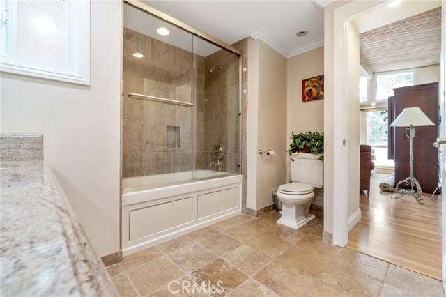 Bathroom tub with shower and decorative tile