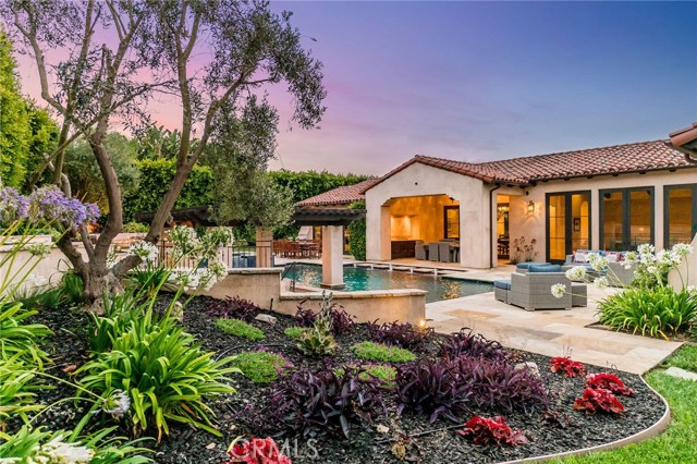 2828 Via Neve Palos Verdes Estates, California Lower Lunada Bay Resort Style Living at it's finest. This spectacular Mediterranean Style Villa is located in a private & tranquil neighborhood with easy access on and off the Palos Verdes Peninsula. Luanda Bay in known for commanding great bluff top views of the Pacific Ocean & Catalina Island. If your looking for and entertainer's dream home with an Indoor/Outdoor/Live/Work lifestyle look no further. This one of a kind, one level home features French doors throughout that lead to the extraordinary backyard featuring a salt water pool & spa, swim-up bar, pool pavilion with built in BBQ, refrigerator and sink. Expansive stone patios, large grassy areas, and a fire pit compliment his private and serene outdoor area. Enter into a spacious living room with travertine floors, dramatic fireplace, vaulted ceiling with ten foot French doors. The formal dining room has an infinity style door that opens up to the loggia. If you have a flair for cooking this gourmet kitchen has a center island, Wold stove along with Sub-Zero Appliances, double dishwashers, with a well lit breakfast nook. The family room is anchored by a seabed fossil stone fireplace. The bedroom wing of the home offers four bedroom suites, with a master suite with fireplace, his & hers walk in closets, private patio with a master bath. The fifth bedroom doubles as an office, additionally the executive home theater adds the final touch to a truly amazing home. Close to shopping, restaurants, schools and the ocean.