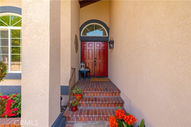 Welcoming front with brick stairs.