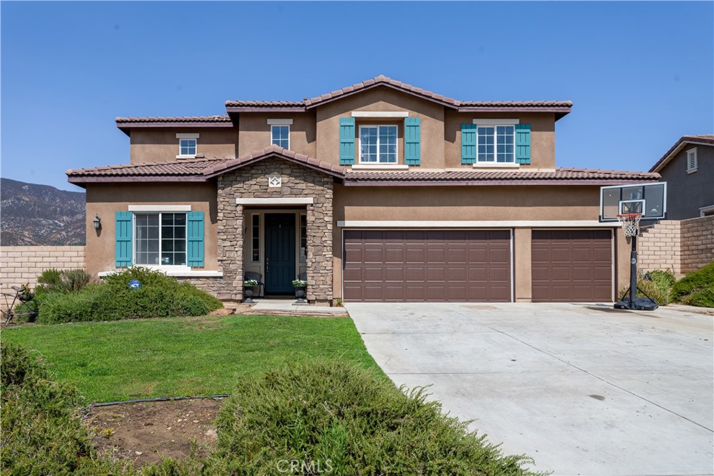 5431 N Valles Drive San Bernardino, California BEAUTIFUL VIEWS! Upon entry into this exclusive 5-bedroom home in the Pinnacle neighborhood at University Park, you are welcomed by a lovely foyer, a large dining room area, and open concept family room with a fireplace. The kitchen offers granite counters, a large island, stainless appliances, recessed lighting, and plenty of storage space. The downstairs bedroom and bathroom are perfect for extended family/guests or the bedroom could be utilized as a home office. There is so much fun to be had as you make your way upstairs into the spacious loft that is currently utilized as a theater/media room. The master suite is very spacious and includes a seating area and a large walk-in closet with a balcony that overlooks the amazing views offered by this home! The master bathroom has a separate shower, oval tub, and his and hers sinks. The other 3 bedrooms are generously sized and enjoy the hall bathroom with dual sinks. The laundry room is conveniently located upstairs. The home sits on a large 10k+ flat lot with scenic views and plenty of room for a pool. The backyard also features a charming custom-built playhouse and swing set that stays with the house! The 3-car garage offers plenty of space for storage. With easy access to the 215 and 15 freeways, minutes from Cal State SB University and shopping/restaurants, and with No HOA, this home is ready for you to move right in and enjoy!