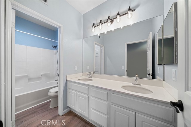 Model perfect remodeled guest bathroom with dual sinks