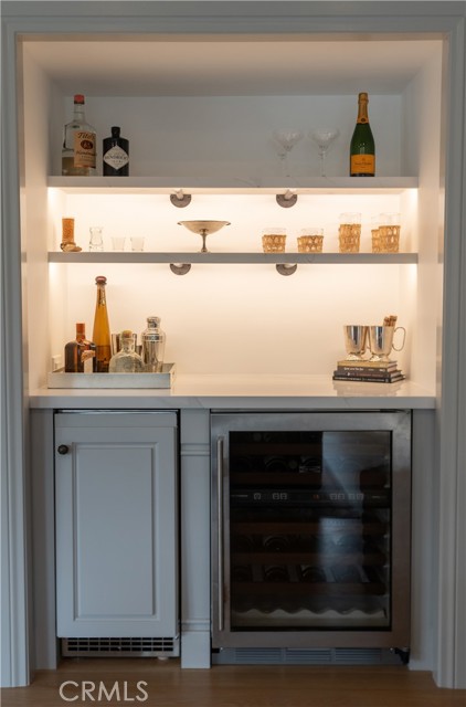 Bar with wine refrigerator and ice maker, located in Family Room.