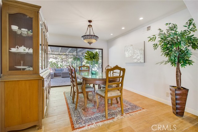 Formal dining room leads out to side yard for indoor/outdoor dining experience.