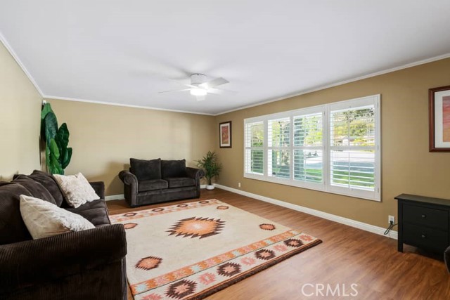 Large Living Room With Plantation Shudders Throughout The Home