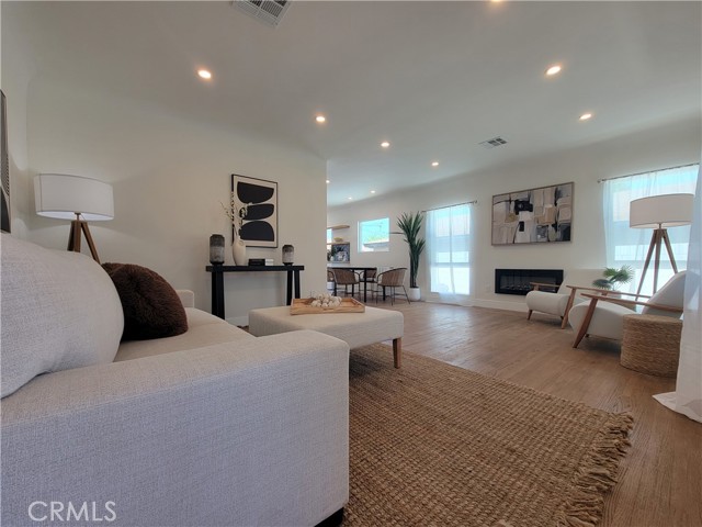 Open Floor Plan with refinished original hardwood floors