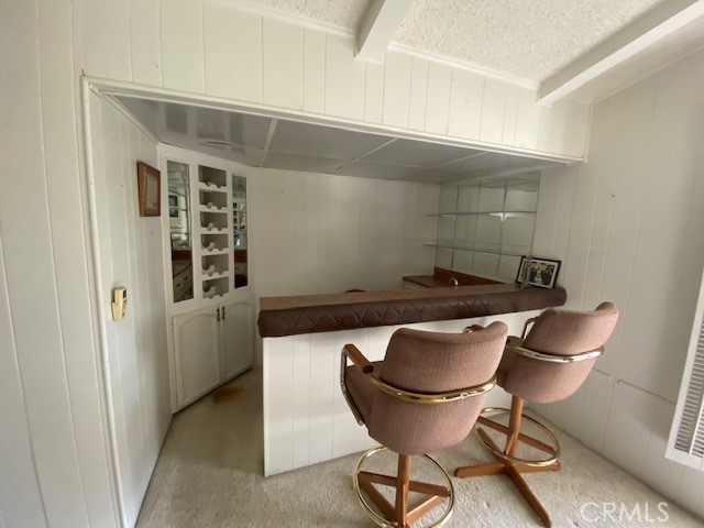 Bar/office area with shelving and storage