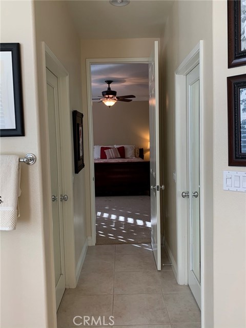 From master bathroom towards bedroom with two mirrored closets on each side.