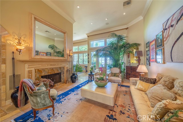 12530 The Vista Brentwood, California Highly Customized 3-Level Home in Brentwood reminiscent of a French Chateau with Gorgeous 180 views of the mountains, Golf Course and Downtown LA in the exclusive gated community of Mountaingate. Superb for indoor/outdoor entertaining, with upper balcony showcasing stunning Vistas, and beautifully landscaped lower patio in backyard, featuring a spa w/waterfall in a very private setting. 18 foot ceilings in entry and Livingroom, stone mural and custom cabinetry in kitchen, French windows and doors throughout let in lots of light. 3 fireplaces, including one in the Master Suite and one in the adjoining sitting room/office for a cozy atmosphere. Each Master Suite and attached bath are on different floors for complete privacy. Spa bathroom downstairs features Steam Shower and 2 person Jacuzzi Tub. Tiered zones for music and heating/AC so custom settings can be made on each floor. Guard-gated community with 24/7 roving Patrols and Golf/Tennis memberships are available. Stunning Primary Residence or perfect for Bi-costal Executive needing an Exclusive Pied a Terre.