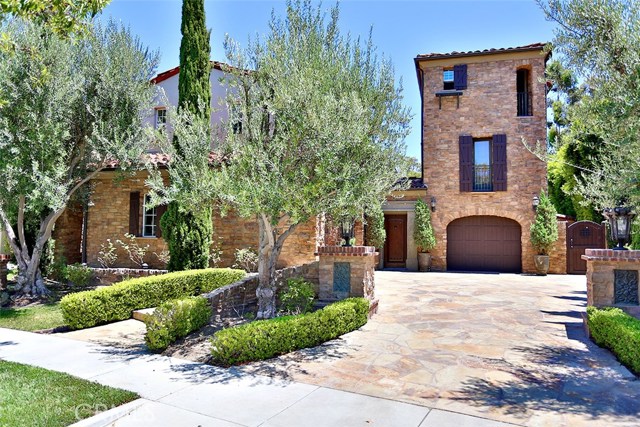 30 Sylvan Irvine, California Gorgeous home in the gated community of Summit at Turtle Ridge. Lovely courtyard entry includes a fireplace & sparkling fountain. This Tuscan inspired home features distressed hardwood floors, wood beam ceilings and striking stone accents. The gourmet kitchen with a large center island has granite countertops, stainless appliances, wine/storage room, wine refrigerator and walk in pantry. Upstairs in the main home is the spacious master suite with its cozy fireplace and private balcony which overlooks the beautiful pool. Two additional bedrooms with a shared bathroom and laundry are also upstairs. This amazing floor plan has a detached Casita. The Casita has a separate entrance, bedroom/bathroom suite and a studio/bonus room. Enjoy entertaining in the privacy of your own backyard, pool, spa, outdoor kitchen, fireplace – wow -this home has it all. You also have all the amenities of this terrific gated community to enjoy; Resort style pools, trails, playgrounds, gym and you are close to award winning schools, shopping and transportation.