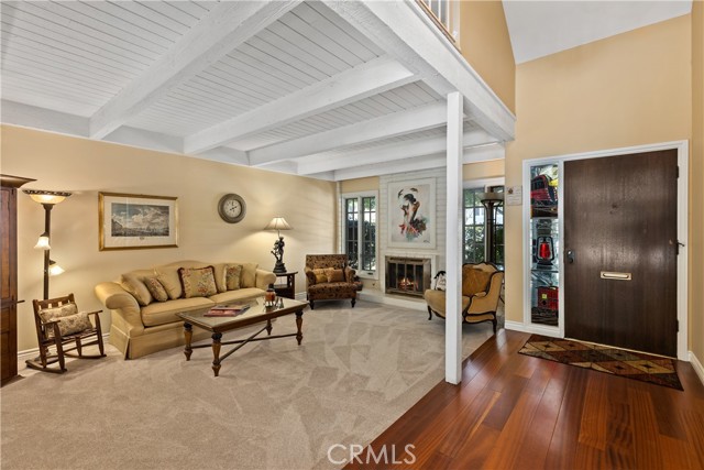 Formal living room with fireplace, new carpeting, and new paint.