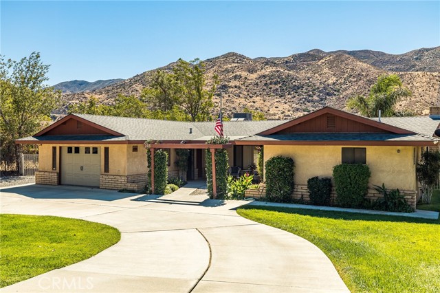 246 Wesley Street Banning, California CUSTOM BUILT 3 BEDROOM 2 BATH RANCH HOME ON PRIME HORSE PROPERTY. This home sits on an acre of land right against the gorgeous Mt. San Jacinto mountains. Upon entering you will be greeted with an open living and kitchen area. The kitchen has been updated with gorgeous quartz counter tops, recessed lighting, freshly painted white kitchen cabinets and a deep stainless steel sink and faucet. You will also, find beautiful wood-look plank tile flooring throughout the main living spaces. Step out back onto a huge covered patio with 2 ceiling fans and a relaxing spa to sink into at the end of the day. There is a fully fenced corral, fully fenced open pasture and a fenced dog run on side of house. You will also find an enclosed carport that is plumbed for sewer with a lean to attached which affords lots of extra storage space. RV parking is an extra bonus.