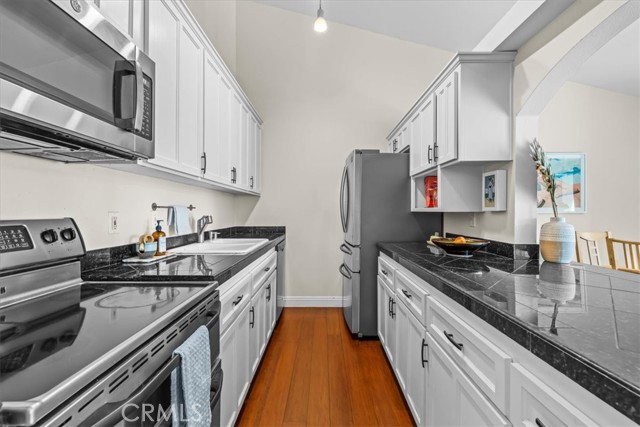 Kitchen has newer appliances - refrigerator, dishwasher and microwave less than 2 years old