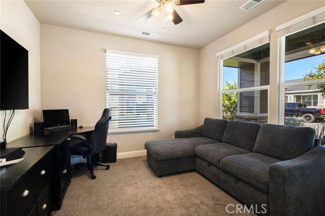 Den/bonus space with double french door entry.