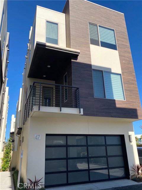 47 Ebb Tide Circle Newport Beach, California Luxurious home with Panoramic ocean and city views from the rooftop deck, located in prestigious Ebb Tide! Stunning 4-bedroom modern home in Newport Height and its move-in ready! This contemporary home has Three levels and high ceilings. The first floor bedroom has an attached bathroom. Second Floor is open space living area with a large kitchen island, and upgraded stove, built in refrigerator and microwave, wine fridge, and dishwasher. This luxurious home features large windows with great source of natural light and automatic shades throughout the home. Family room is prewired with built- in speakers. Two cars garage with electric Car plug in. The Ebb Tide Community offers a private pool and spa.