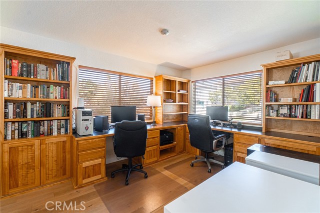 Office with fabulous built ins and tons of natural light! Views from the large windows! Could be changed back into the 3rd bedroom