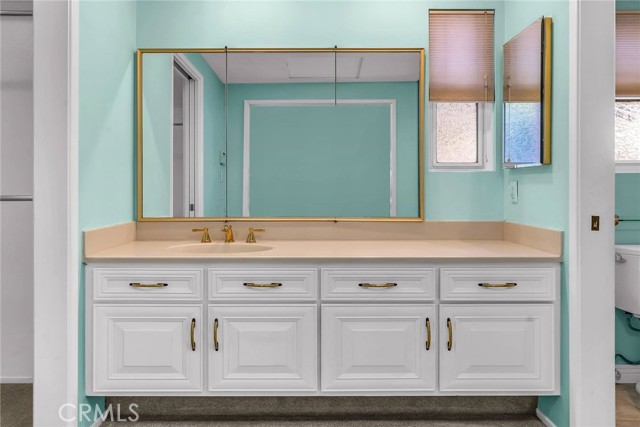 Master Bathroom Vanity with walk-in closet to your left and 3/4 bath to your right