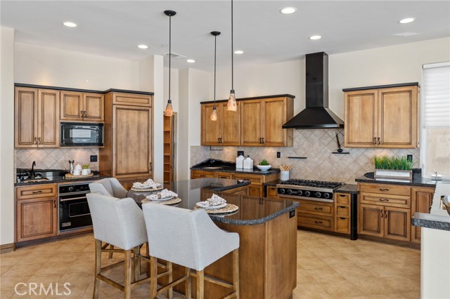 The professional-grade kitchen with a walk-in pantry is perfect for preparing gourmet meals.
