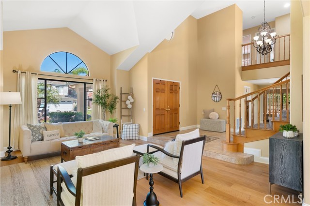 As you enter the home, you are greeted by vaulted ceilings and beautiful natural light