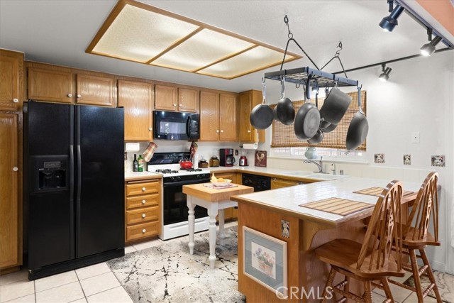 Tile countertops and cabinets are in PERFECT! condition