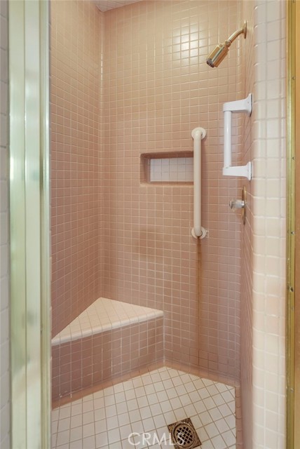 Third Bathroom shower with seat.