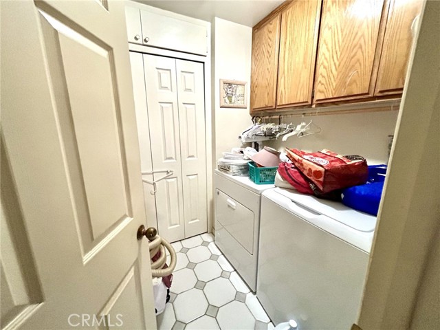 Laundry room located entry level, lots of storage