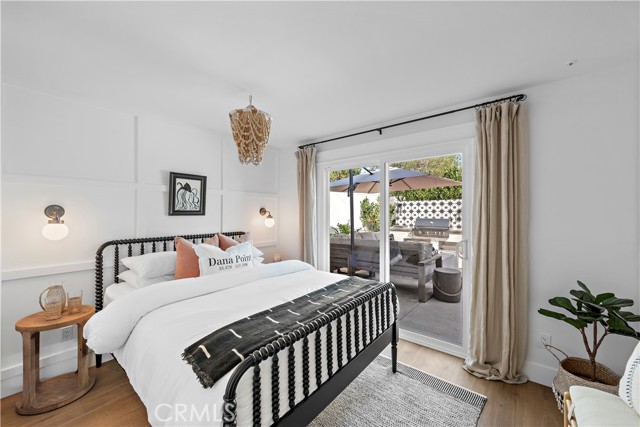 Additional downstairs secondary bedroom with Queen bed that opens to the backyard.