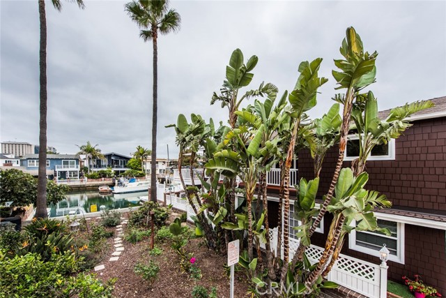 A prime corner lot and adjacent tropical garden add to the appeal of this property.