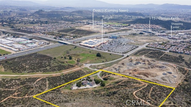 Residential Development Opportunity on 10.26 acres in the path of growth. Tenant occupied income-producing property, currently rented under-market generating $3,000 per month. Easy access to the I-215 freeway with great freeway visibility. Terrific views of the valley. Located across the street from a recently approved multi-family project and approved hotels and Orchards at Stone Creek, Super Target, Starbucks, Subway, Tractor Supply Company including others with the new Costo just across the freeway.  It currently has two rental units totaling 5 bedrooms, and 3 baths with a finished office in the detached garage.