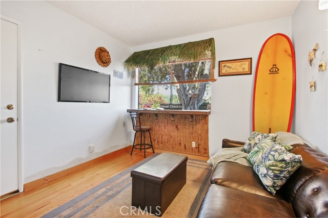 Main floor bedroom # 4 (currently used as den) with door to patio.