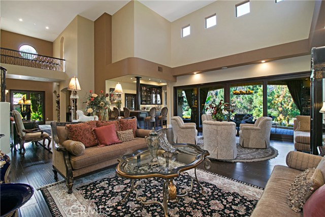 The family room and living room are very spacious with access to the Lanai and downstairs bedroom suite.