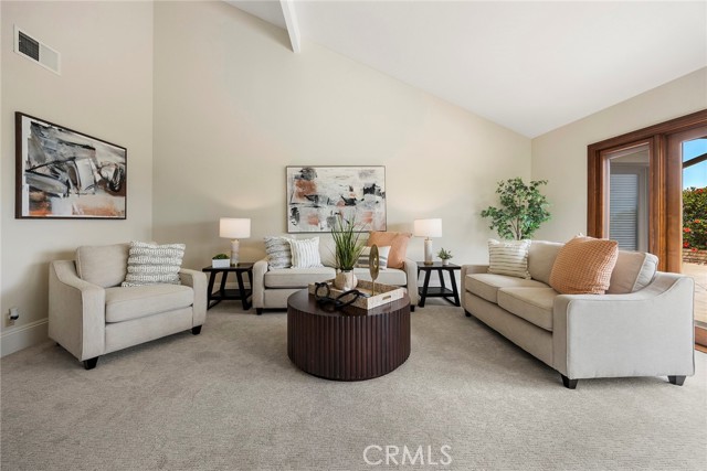 Large formal living room is a great space to entertain your family and friends.  High ceilings with direct access to the backyard.