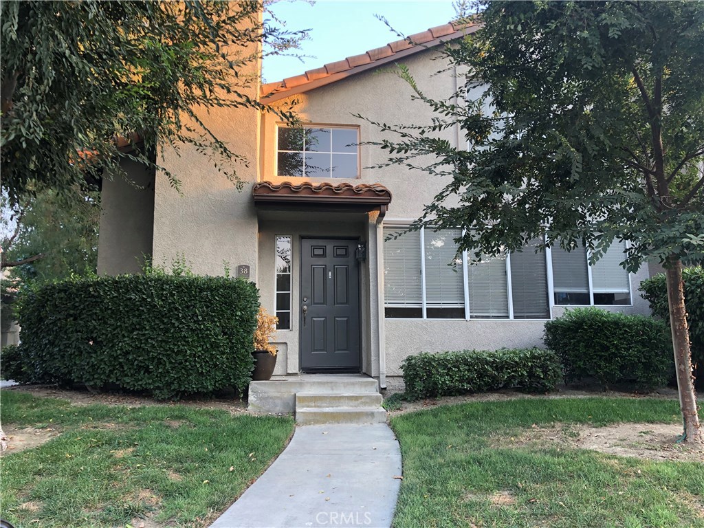 Located in the gated community of Windflower within minutes to Aliso Viejo's Town Center to shopping, theatre and restaurants.  Private gated community is this well located end unit three bedroom, 3 bath. One bedroom downstairs with access to full bath.  Two bedrooms upstairs with private baths and great closet space.  Open kitchen and dining room to the living room with fireplace. Easy care wood laminate flooring with tiile in kitchen and baths.  Enjoy open views looking through the large atrium windows to the greenbelt.  Easy direct access from your over sizeed, side by side garage into the unit. It includes a full size washer and dryer located in the garage and kitchen includes a stainless refrigerator.  Plenty of parking for guests.  
Windflower community HOA includes a pool/spa, barbeque area and playground.