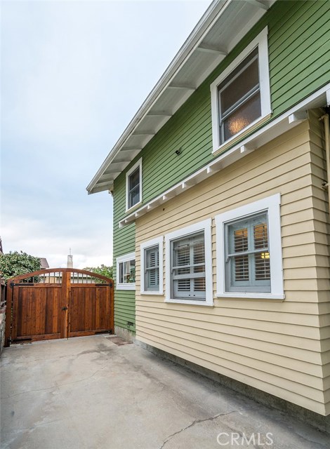 Front neighborhood exclusive driveway to the heavy wooden castle gates.