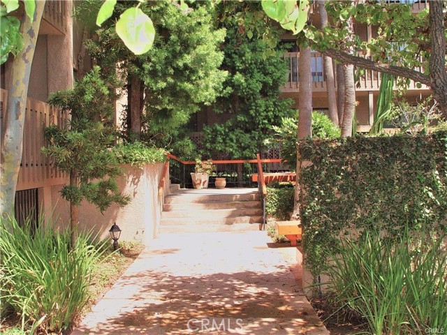 The Broad, Open Walkway leading to the Front Main Building Entrance is very Open and Inviting.