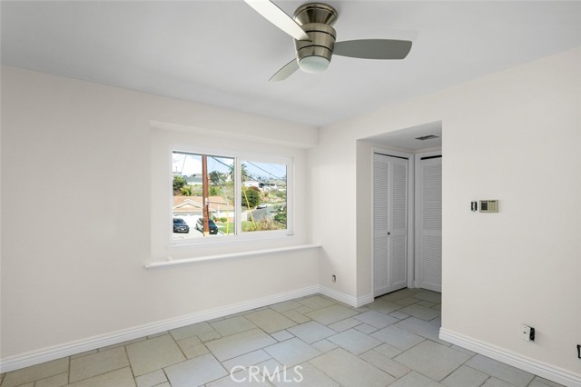 Primary Bedroom also has ceiling fan with light. This room is deceptively large!