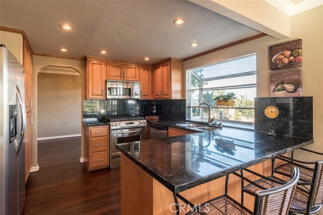 Kitchen opens to the family room and connects to the Living room and  dining area and park-like yard for entertainment
