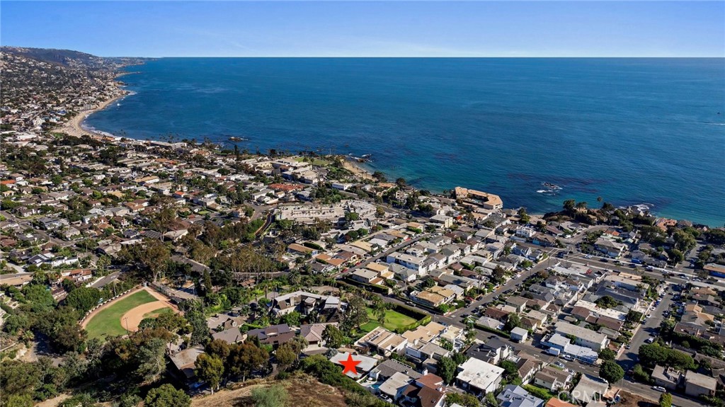 With panoramic views of Laguna's coastline and twinkling city lights, this mid-century home has arguably one of the best views in Laguna. Soak in views of Catalina Island, Main Beach, white water views and the California Riviera coast to the Headlands in Dana Point and beyond. Originally built by renowned mid-century architect, Knowlton Fernald, this single level home is nestled above the hustle of the city, resulting in a private and serene setting. Inside you’ll find an open concept floor plan with new wood flooring, and glass windows from floor to ceiling to enjoy the view from just about any spot in the home. Whether you’re enjoying the home's expansive deck or cooking with a new Viking range, you’ll feel enveloped by the natural surroundings. This home is ideal for someone looking for a peaceful setting with dramatic views while also being in close proximity to downtown restaurants, beaches, and miles of hiking & biking trails.