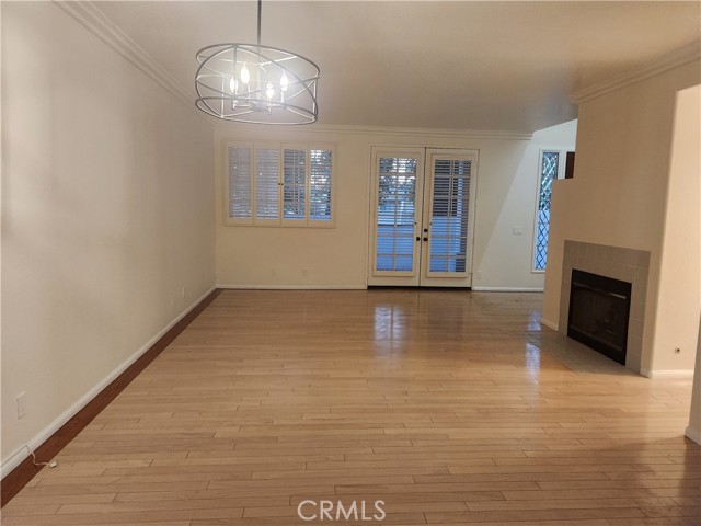 Living room with fireplace and doors leading to patio