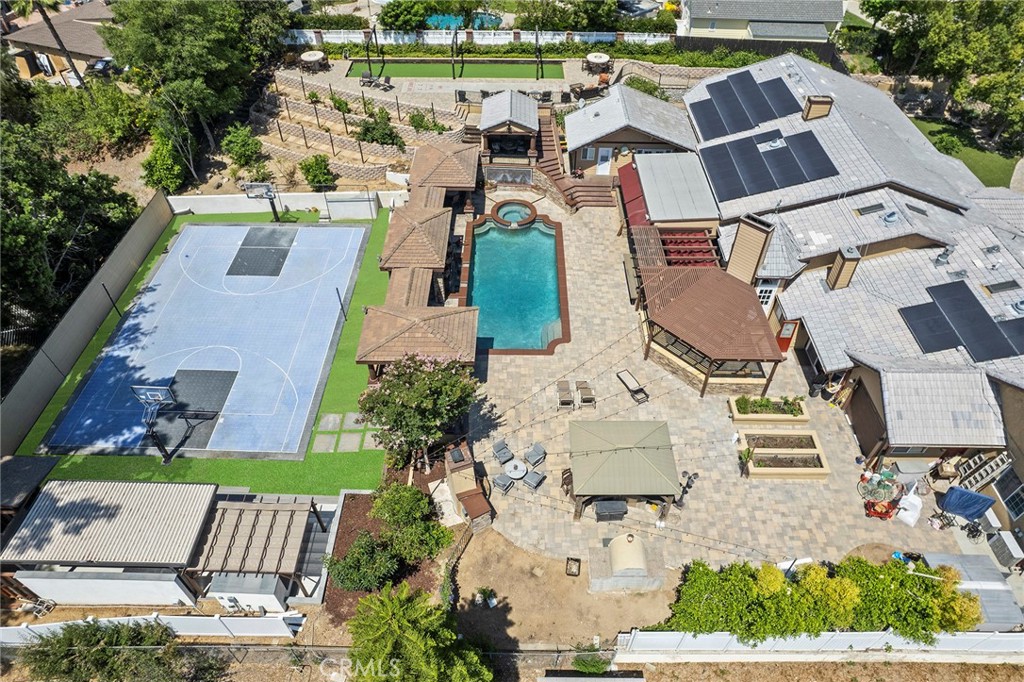 This property has a DETACHED Casita with bed & bath overlooking pool and grounds that are set up for massive entertaining.