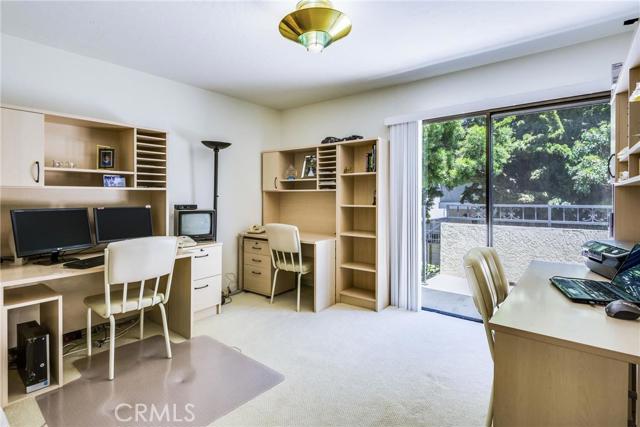 Bedroom 1 with balcony and access to back yard.
