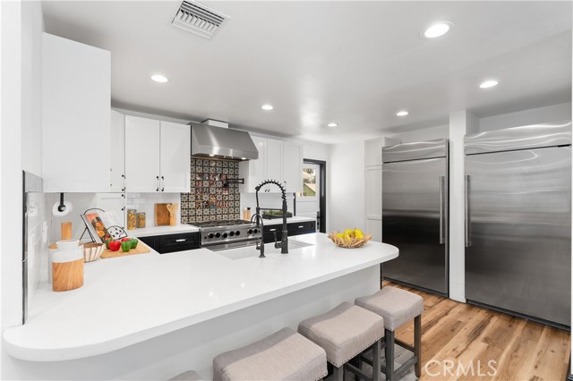 The gourmet kitchen is wonderful. Notice the SEPARATE built-in refrigerator (right) and freezer (left).