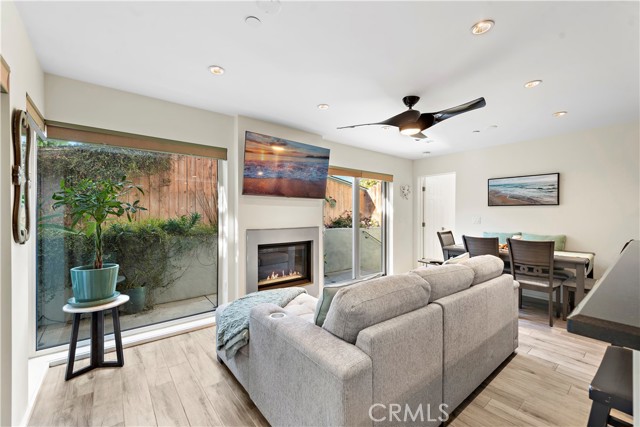 Living room boasts lots of natural light and It’s own fireplace