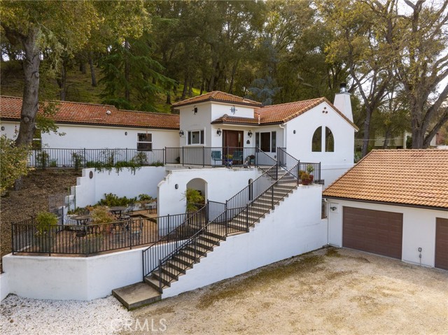 Steps lead you up to the front door.  On the way up you'll walk past one of the private patio areas.