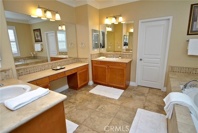 Travertine Counter His and Her Custom Vanities and Make-up Bench