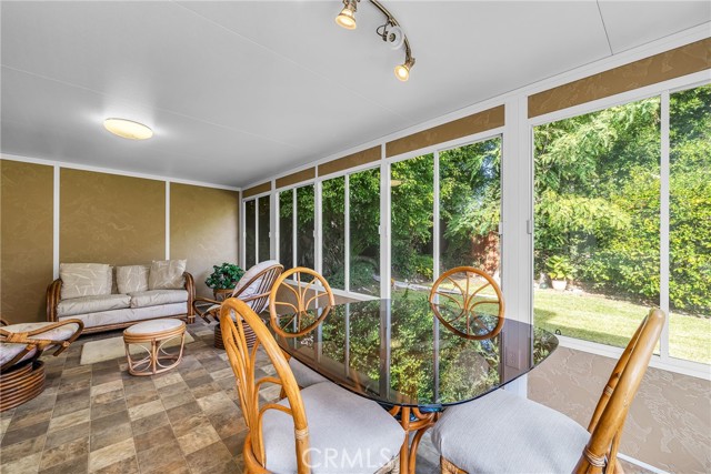 Enclosed porch with a view of the back yard