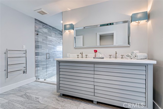 Stunning bath adjacent to the den (or 4th bedroom)with dual sinks and oversized closet transformed into a cozy office nook.