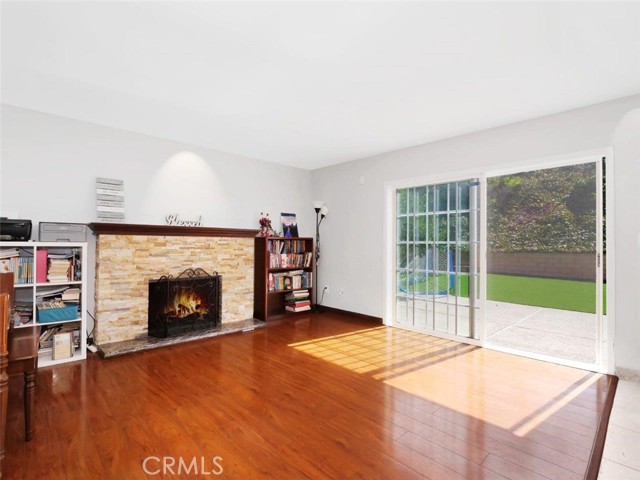 Family Room with Fireplace opens to the Backyard