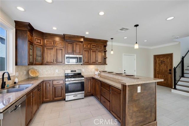 Kitchen boasts abundant storage cabinetry.