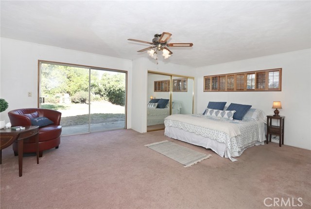 Main bedroom, with access to the backyard, two walk-in closets and a third closet with sliding glass doors