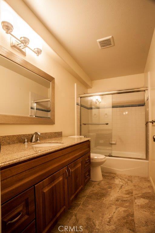 Newly remodeled bathroom, tile flooring, new cabinets and granite counters, new lighting, new shower enclosure and all hardware.